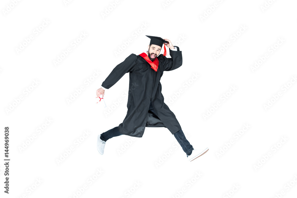 young student in graduation cap with diploma jumping isolated on white young student in graduation cap with diploma jumping isolated on white