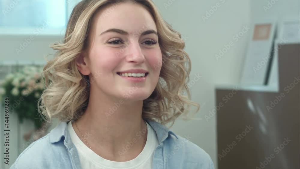 Young woman enjoy the result of hairdresser work in beauty salon Young woman enjoy the result of hairdresser work in beauty salon