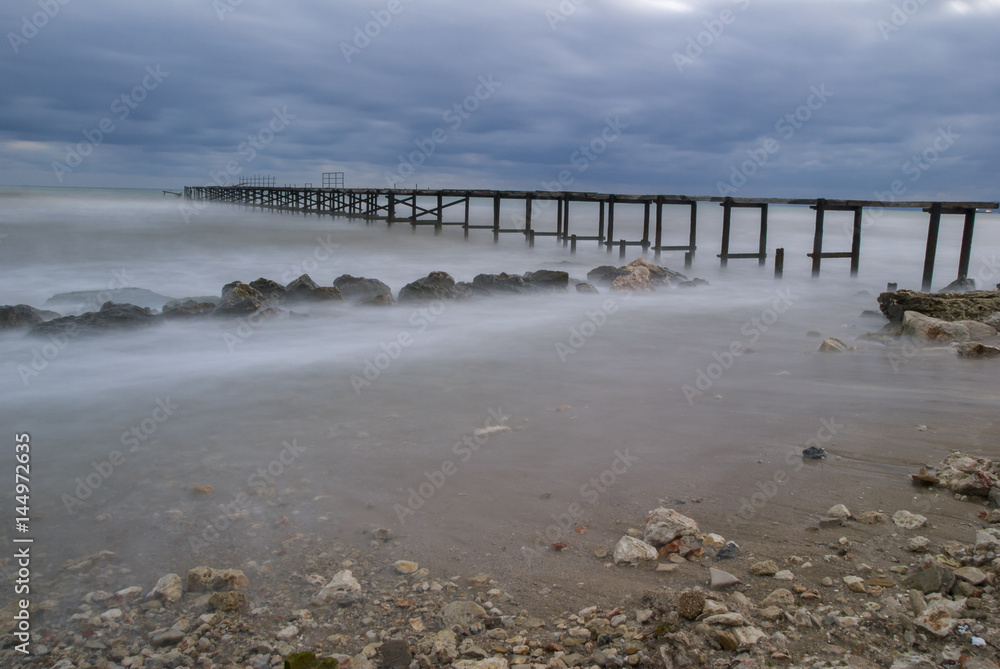Deserted pier before a storm on the shore of the Black Sea in Bulgaria