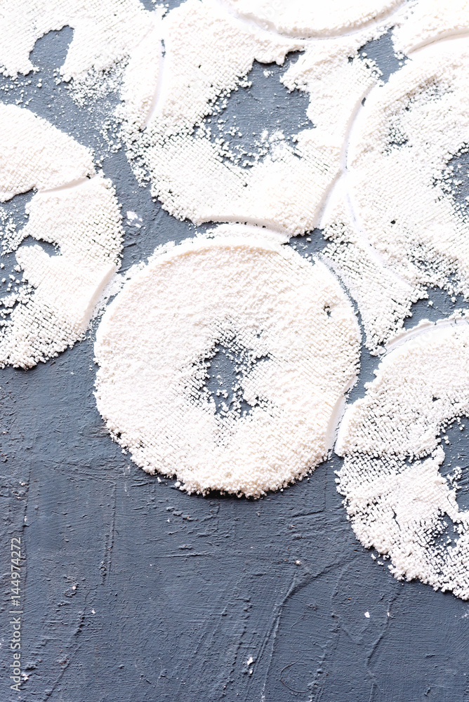 Abstract food background Flour circles on background Vertical photo Abstract food background Flour circles on background Vertical photo