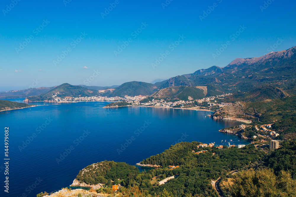 Panorama of the coastline of Budva Riviera from the mountain on a sunny day. Montenegro.