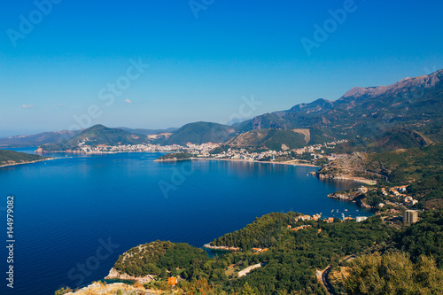 Panorama of the coastline of Budva Riviera from the mountain on a sunny day. Montenegro.