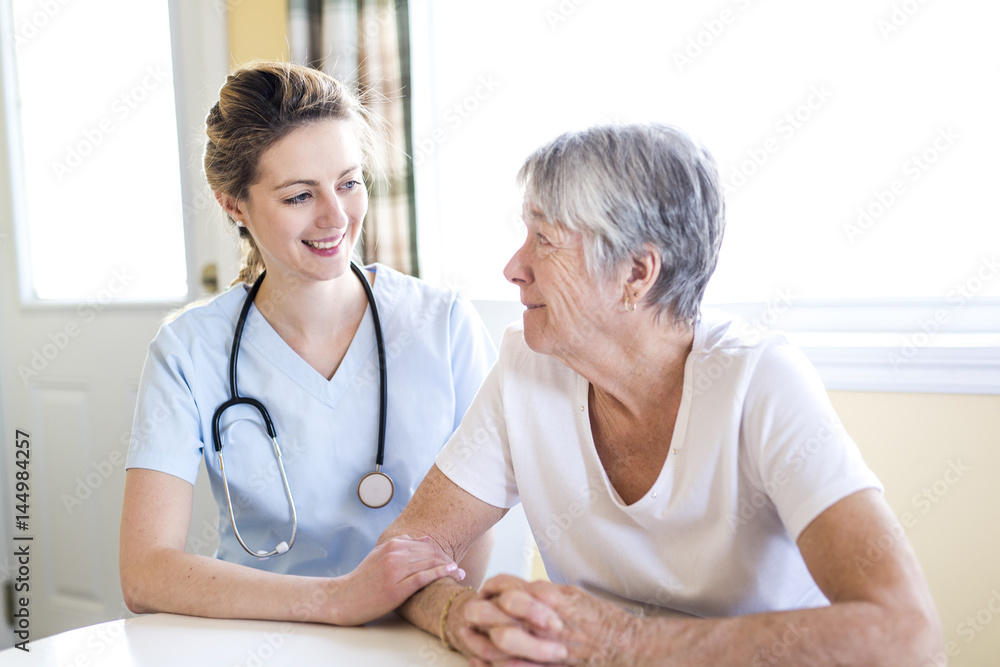 Senior woman with her caregiver at home Senior woman with her caregiver at home