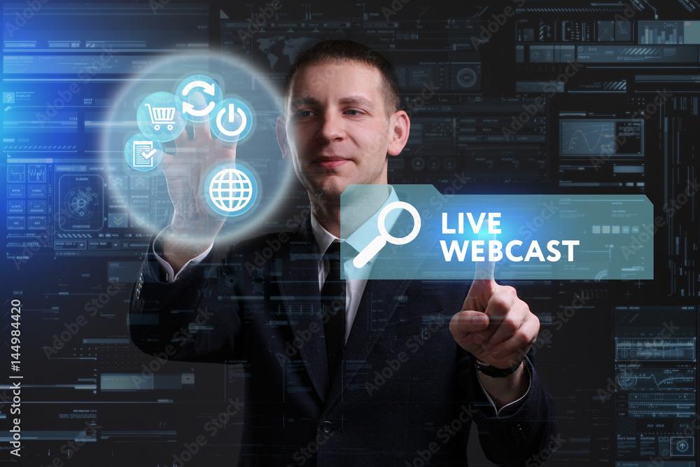 Business, Technology, Internet and network concept. Young businessman working on a virtual screen of the future and sees the inscription: Live webcast Business, Technology, Internet and network concept. Young businessman working on a virtual screen of the future and sees the inscription: Live webcast