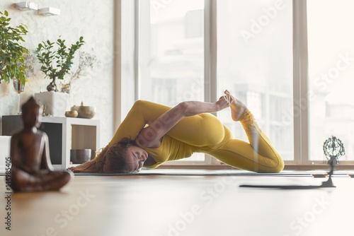 Healthy female yogi flexing her body