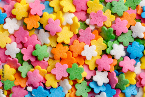 Sugar sprinkle flowers, decoration for cake and bekery, a lot of sprinkles as food background