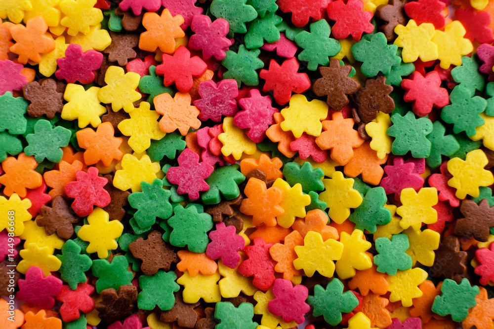 Sugar sprinkle leaves, decoration for cake and bekery, a lot of sprinkles as food background Sugar sprinkle leaves, decoration for cake and bekery, a lot of sprinkles as food background