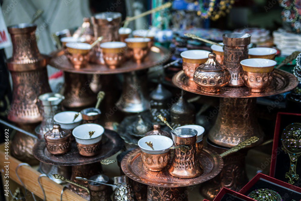 Traditional handcrafted copper coffee pots in souvenir shop in Sarajevo