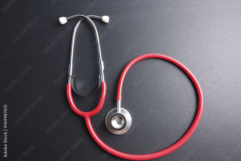 Red stethoscope,keyboard ,puzzle and coins. Medical concept. Red stethoscope,keyboard ,puzzle and coins. Medical concept.