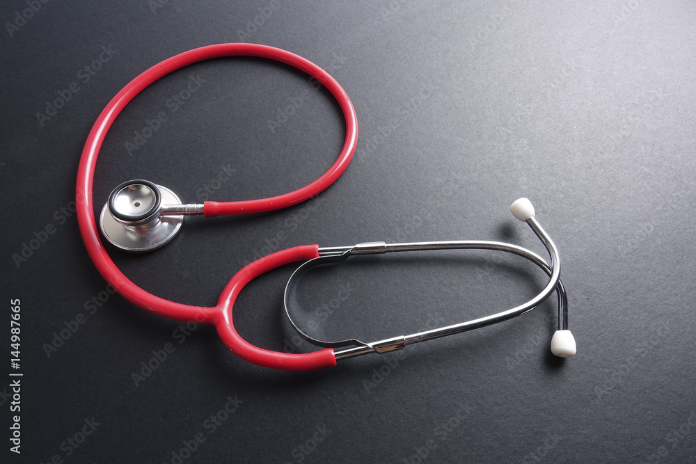 Red stethoscope,keyboard ,puzzle and coins. Medical concept. Red stethoscope,keyboard ,puzzle and coins. Medical concept.