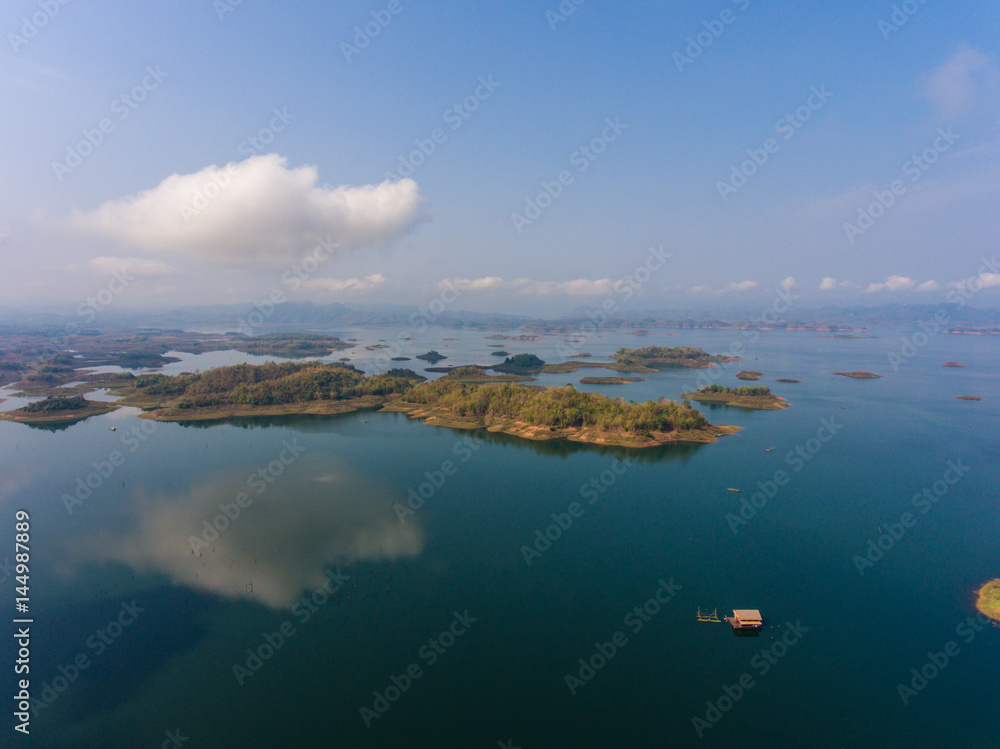 Aerial view of small islands in a lake at morning light