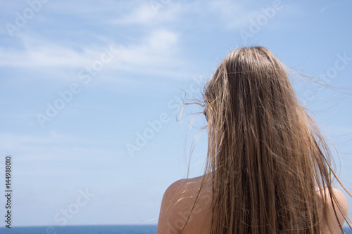 The girl came by car to the rocky seashore to rest