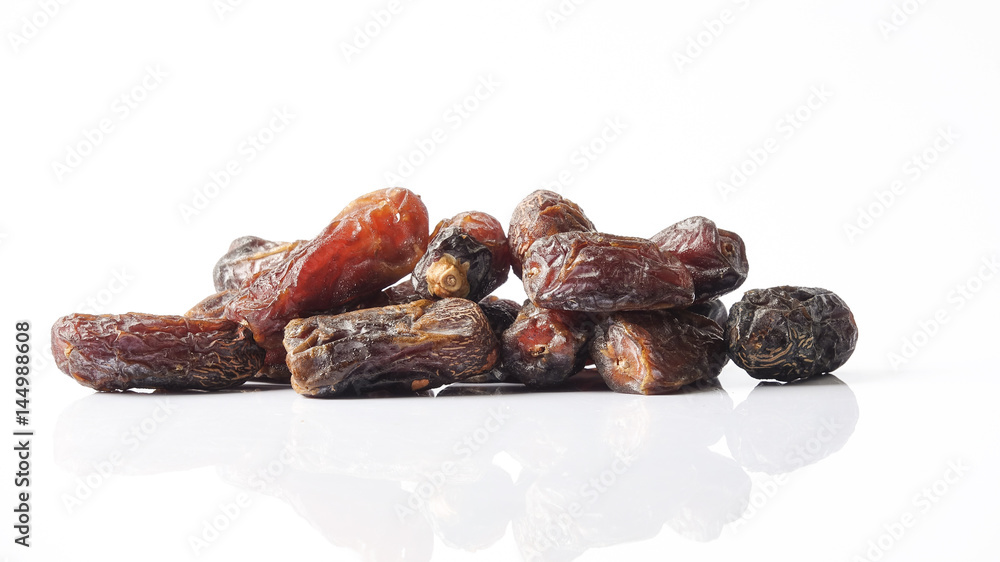 Date fruits on white background. Selective focus. Date fruits on white background. Selective focus.
