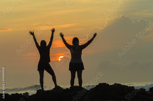 Girls Holiday Expressions Silhouetted Beach Sunrise Ocean