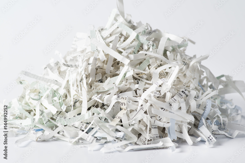 Pile of shredded paper on white background
