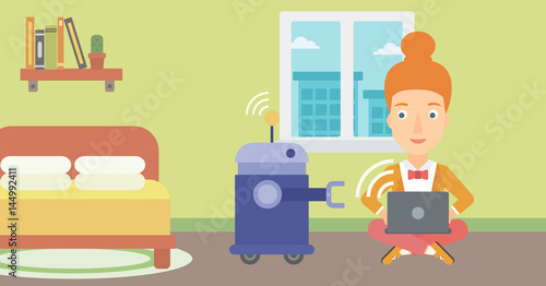 Caucasian engineer programming a robot.