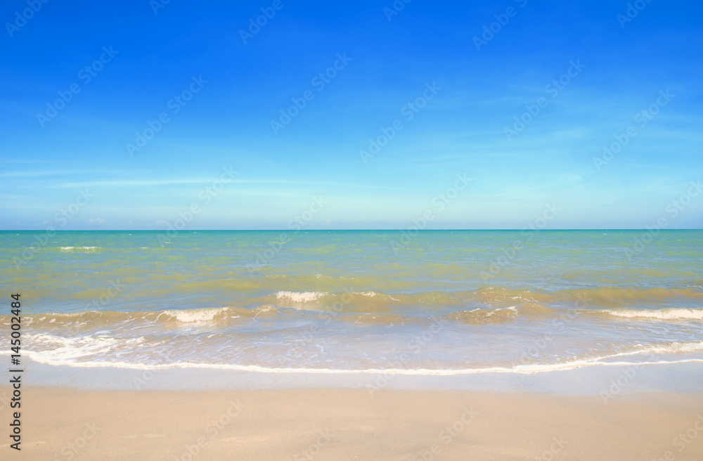 Wave & Sand beach with blue sky background
