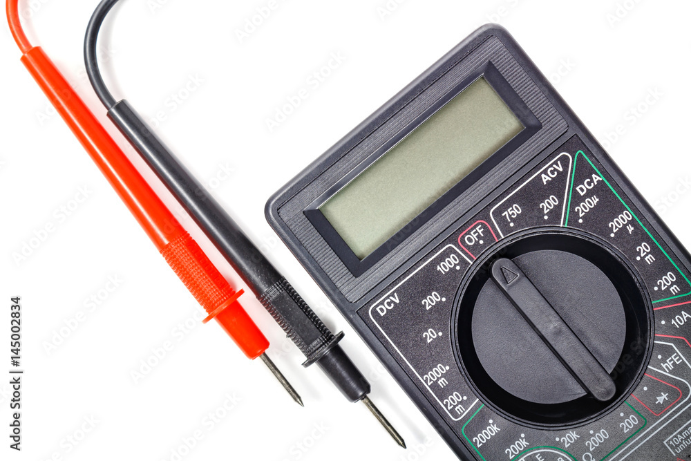 Fragment of digital multimeter with probes closeup on a white background Fragment of digital multimeter with probes closeup on a white background
