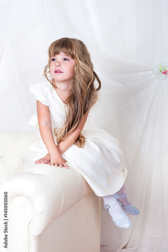 Beautiful baby girl in white dress with long hair Stock Photo Adobe Stock