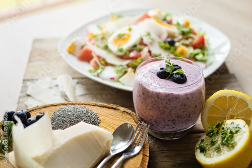 Chia blueberries smoothie and fresh salad, healthy eating concept