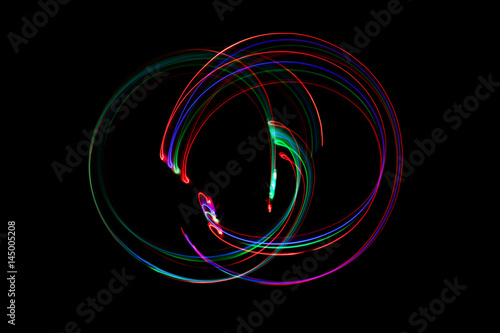 abstract neon light painting on black background.