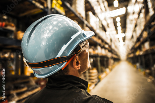 Modern Warehouse Worker in Safety Helmet and Goggles #145005826