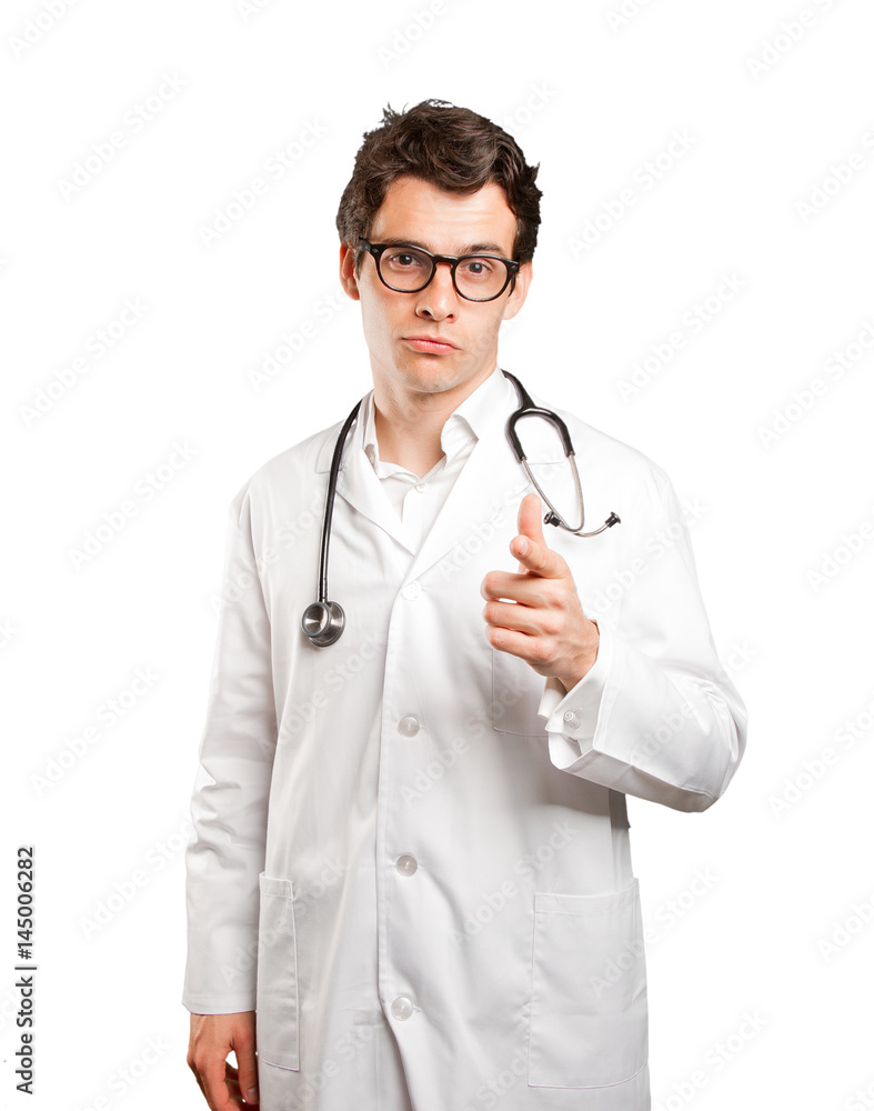 Surprised doctor pointing against white background Surprised doctor pointing against white background