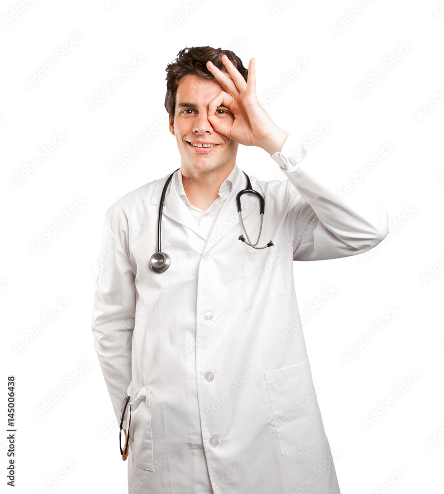 Concentrated doctor searching against white background Concentrated doctor searching against white background