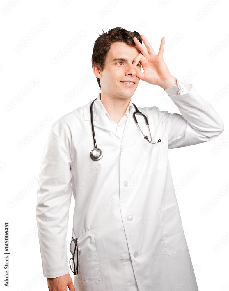 Concentrated doctor searching against white background Concentrated doctor searching against white background
