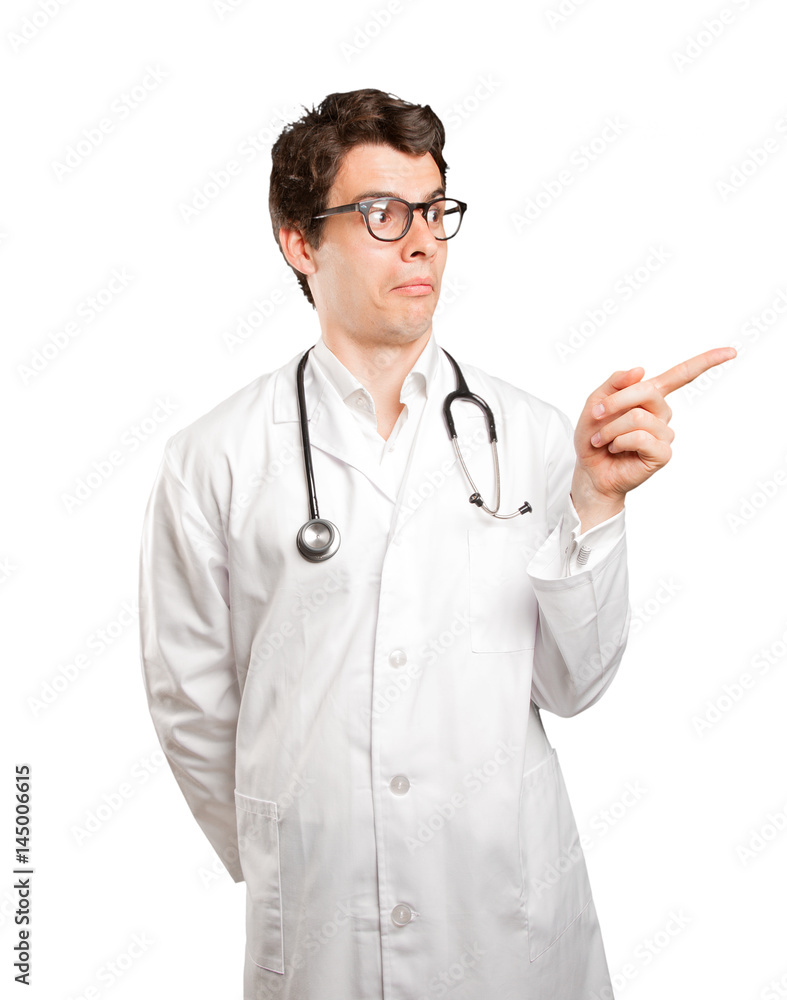 Surprised doctor pointing against white background Surprised doctor pointing against white background
