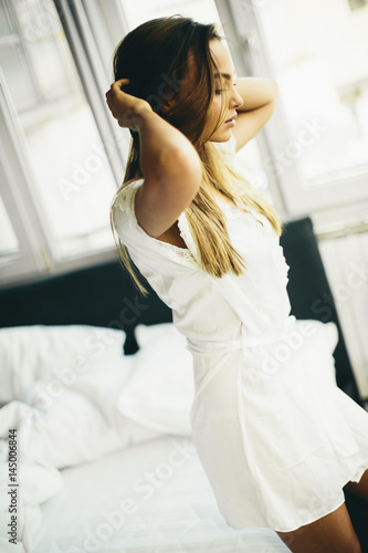 Young woman in the room get...