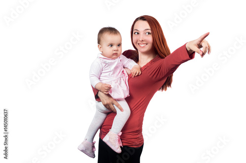 Red hair woman pointing with a infant baby girl. Isolated on white background photo