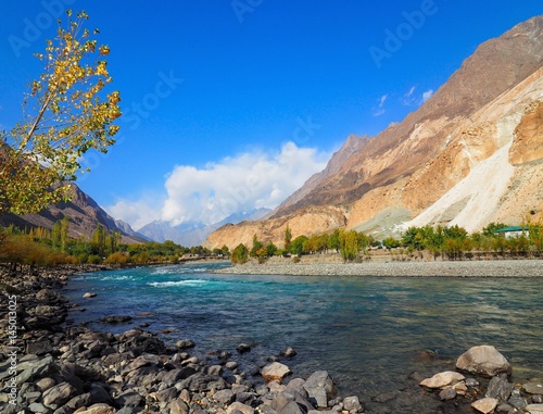Autumn Landscape Of Ghizer River Along Hindu Kush Mountain Range In Ghizer Valley, Northern Pakistan
