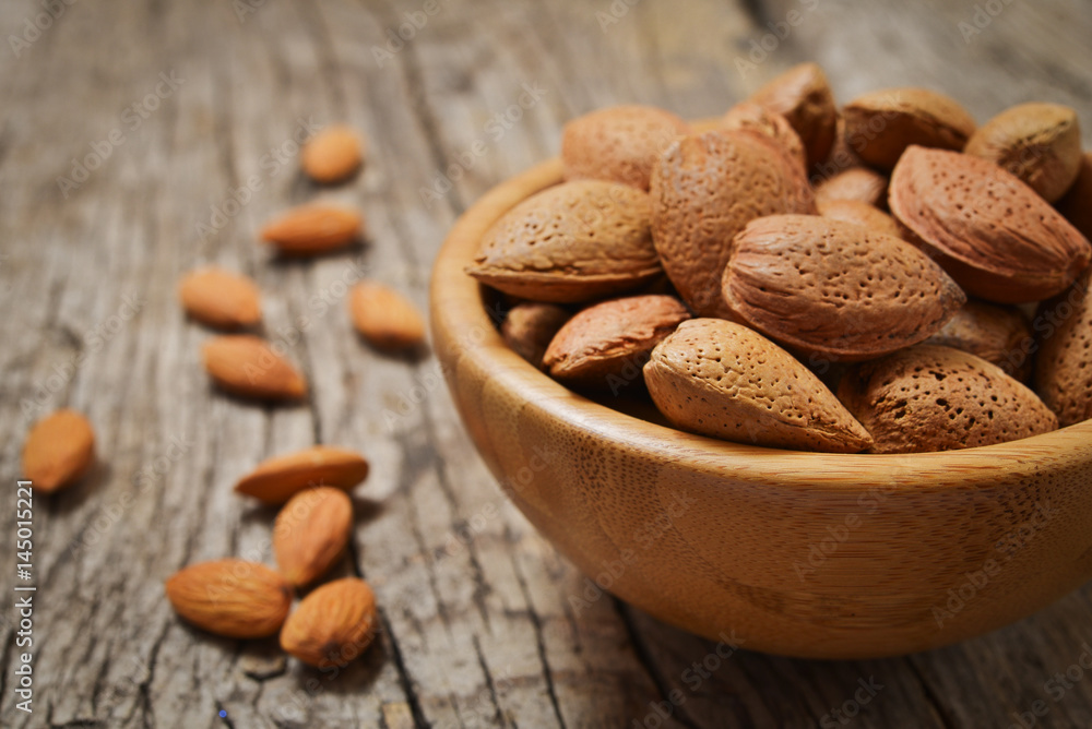almond in a wooden bowl almond in a wooden bowl