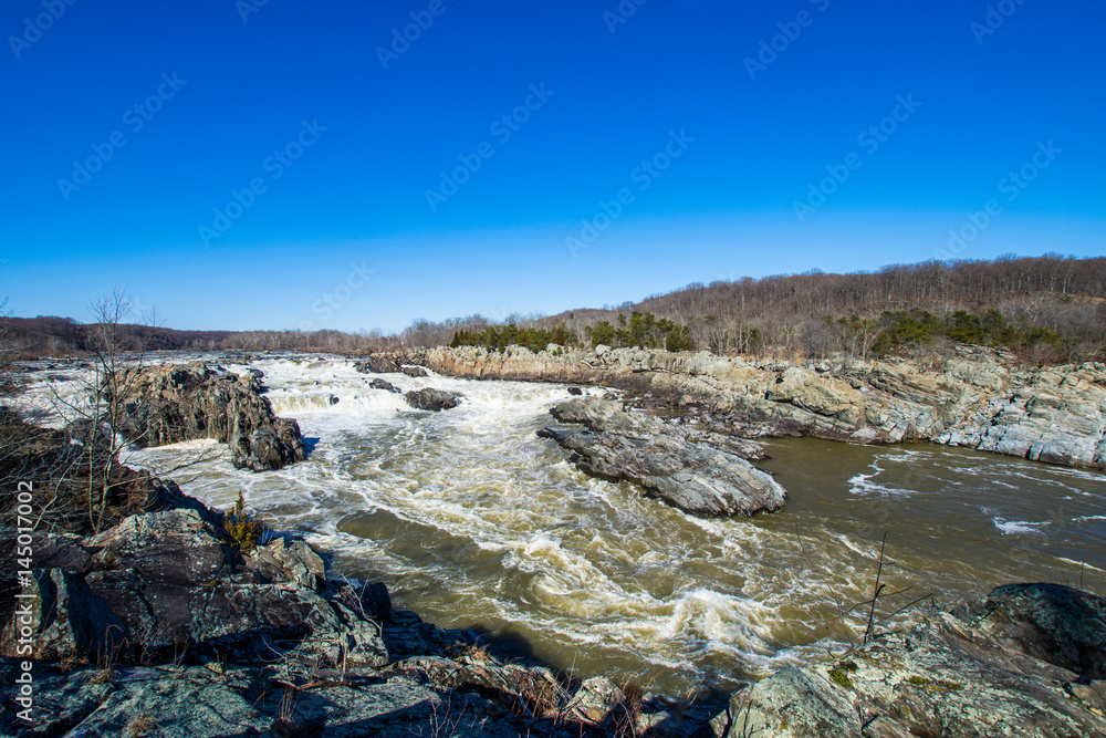 rushing white water in great falls park, virginia side in winter