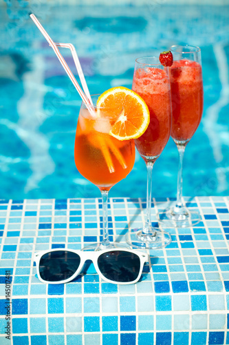 cocktail on the pool nosing at the tropical resort, 