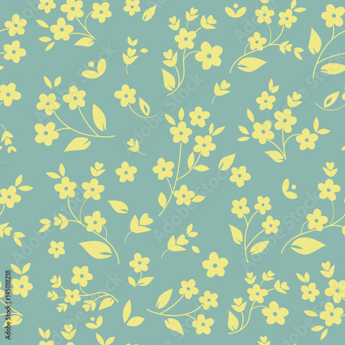 Millefleurs seamless pattern design with small field flowers silhouettes, daisies, botanical elements, light yellow on silver grey background. For fabric prints, wallpaper, upholstery