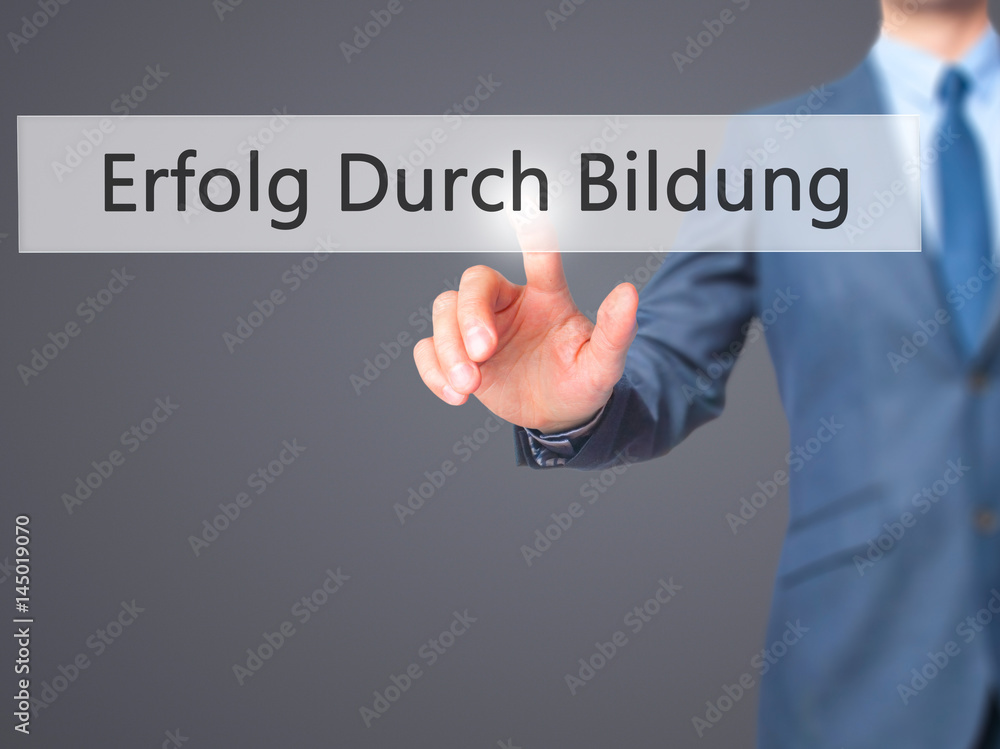 Erfolg Durch Bildung (Success Through Training in German) - Businessman hand pressing button on touch screen interface. Erfolg Durch Bildung (Success Through Training in German) - Businessman hand pressing button on touch screen interface.