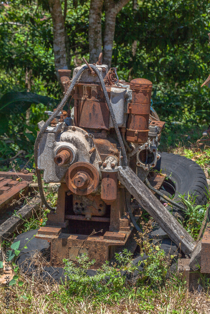 Old machinery rusted up.after the mine.After the mining industry was completed, the mining equipment was left rusty.