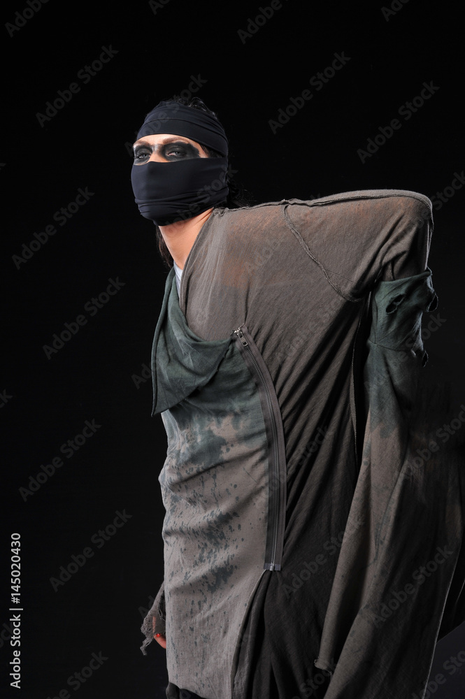 Warrior woman in different design clothes on black background Warrior woman in different design clothes on black background