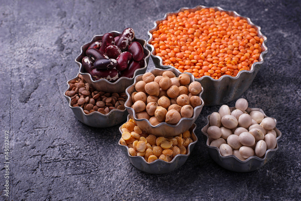 Various legumes. Chickpeas, red lentils, black lentils, yellow peas and beans Various legumes. Chickpeas, red lentils, black lentils, yellow peas and beans