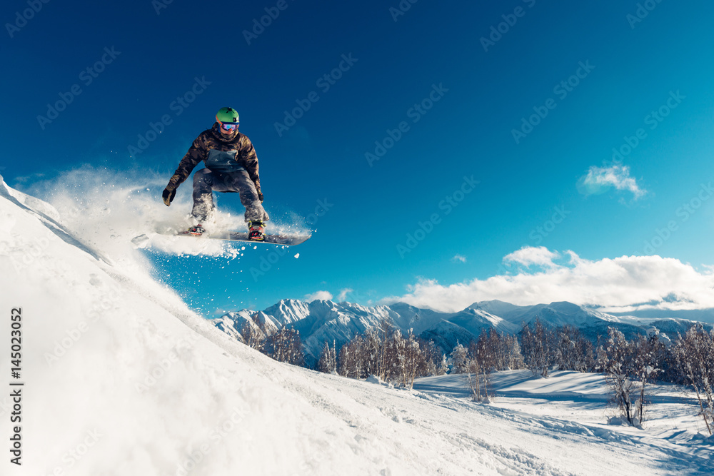 snowboarder is jumping with snowboard - obrazy, fototapety, plakaty 