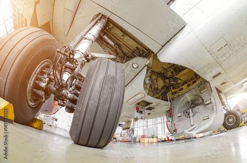 Landing gear airplane in hangar chassis rubber close-up photo