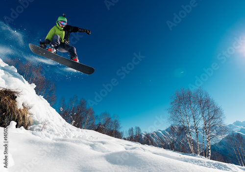 snowboarder is jumping with snowboard