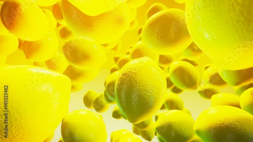 Falling fresh lemon on yellow background photo