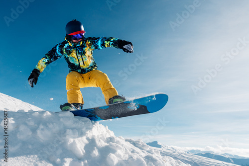 snowboarder is jumping in the sun beam