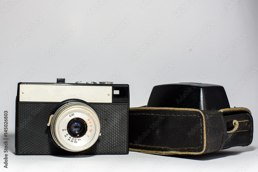 Old Camera with black leather case on a white background