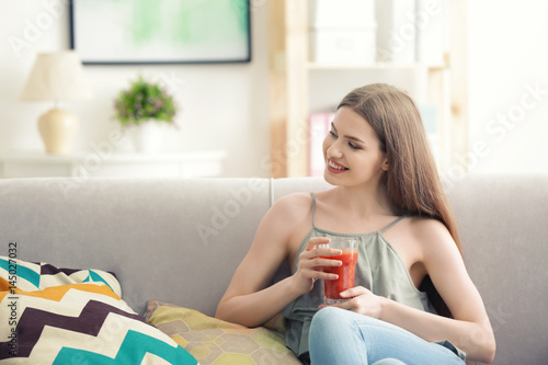 Young woman tasting fresh j...