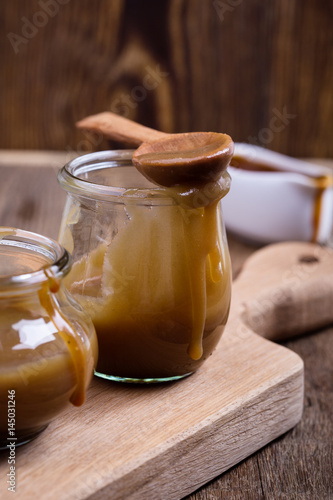 Homemade caramel sauce in glass jar