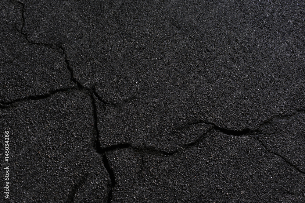 Old destroyed asphalt with cracks